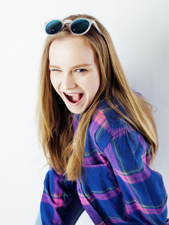 young pretty stylish hipster girl posing emotional isolated on whiteの写真素材