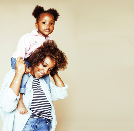 adorable sweet young afro-american mother with cute little girlの写真素材