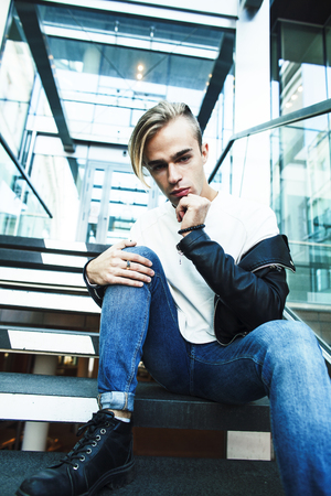 young modern hipster guy at new building universityの写真素材