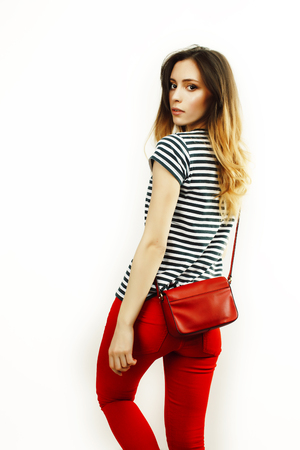 young pretty teenage hipster girl posing emotional happy smilingの写真素材