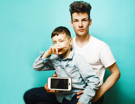 young pretty man model with little cute son playing together, liの写真素材