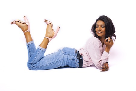 young pretty indian girl in modern casual clothers posing isolated on white background, lifestyle people conceptの写真素材