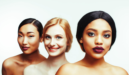 different nation woman: asian, african-american, caucasian together isolated on white background happy smiling, diverse type on skin, lifestyle people concept close upの写真素材