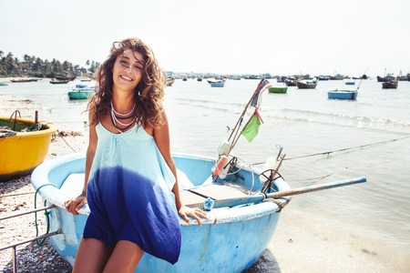 cute smiling young real woman in asian country sea port, vietnam traveller lifestyle