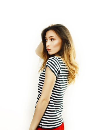 young pretty teenage hipster girl posing emotional happy smiling on white background, lifestyle people concept close upの写真素材