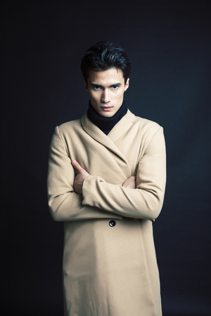 handsome asian fashion looking man posing in studio on black background, lifestyle modern people conceptの写真素材