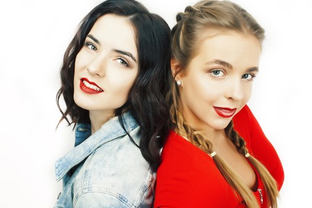 two best friends teenage girls together having fun, posing emotional on white background, besties happy smiling, making selfie, lifestyle people conceptの写真素材
