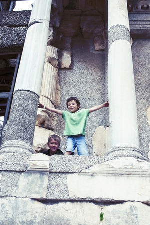 little boy exploring ancient architecture, lifestyle people on summer vacation close upの写真素材