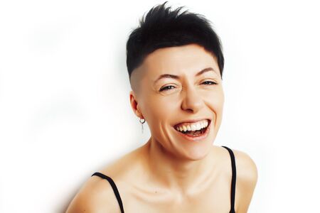 young pretty brunette girl with modern short haircut posing cheerful smiling isolated on white background, lifestyle people conceptの写真素材