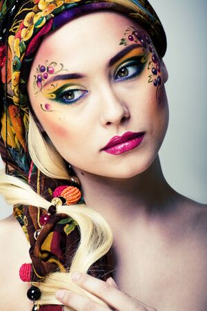 portrait of contemporary noblewoman with face art creative close upの写真素材