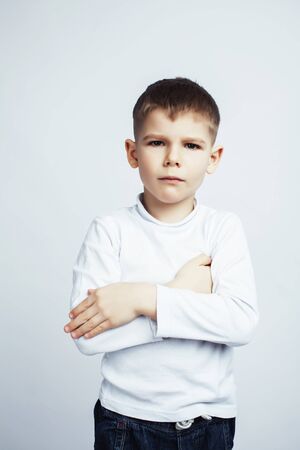 little cute boy on white background gesture smiling close up, lifestyle people conceptの写真素材