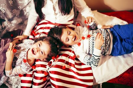 cute family at Christmas, mother son and daughter together having fun, lifestyle people at holidayの写真素材