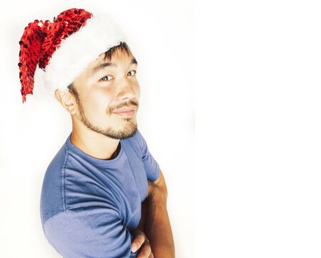 funy exotical asian Santa claus in new years red hat smilingの写真素材