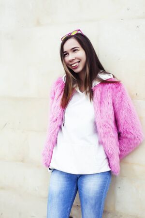 young pretty teenage brunette girl happy smiling outside, lifestyle people conceptの写真素材