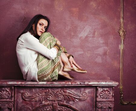 portrait of beauty sensual young woman in oriental style luxury room, lifestyle people close upの写真素材