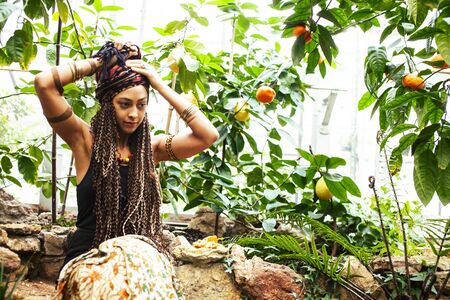pretty islam woman in orange grove smiling, real muslim girl cheerful , nature organic people...