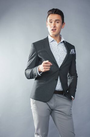 young pretty businessman posing emotional gesturing on white background, lifestyle people conceptの写真素材