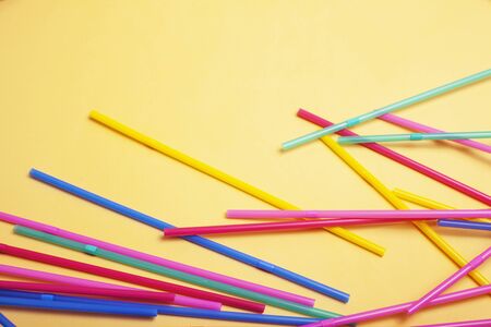 summer stuff on yellow background close up top viewの写真素材