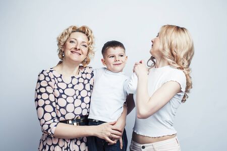 happy smiling blond family together posing cheerful on white background, generation concept. lifestyle peopleの写真素材