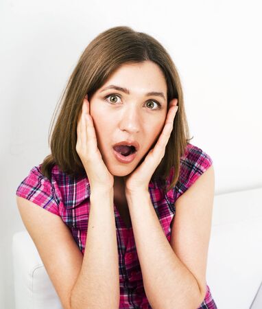 young pretty teenage modern hipster girl posing emotional happy isolated on white background, wearing pink t-shirt, lifestyle people conceptの写真素材