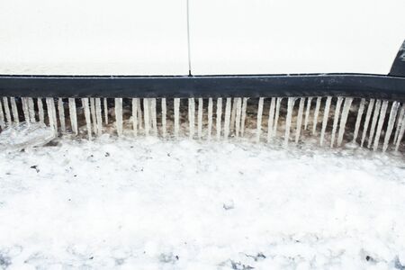 close up photo off car in iciles, a lot of water and snow, seasonal issues concept