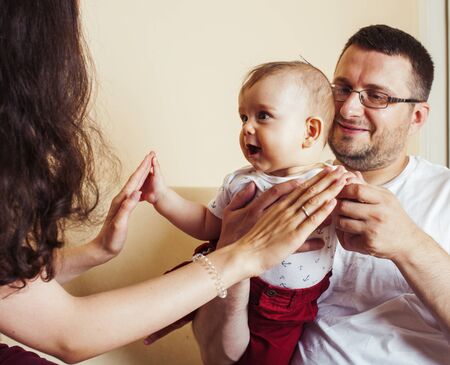 young happy modern family smiling together at home. lifestyle people concept, mother, father and little sonの写真素材