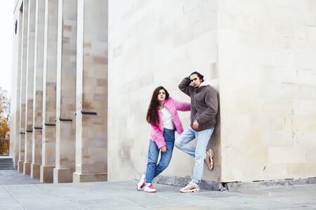 young happy students teenagers at university building on stairs, lifestyle people concept boy and...