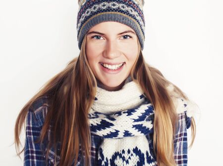 young pretty blond woman in hat and winter scarf smiling cheerful on white background, lifestyle people conceptの写真素材