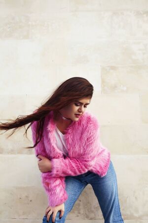 young pretty teenage brunette girl happy smiling outside, lifestyle people conceptの写真素材