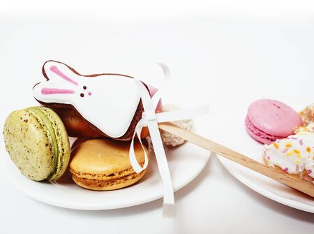 new real diet concept, question between red apple and donut with sweety candies macaroons isolated...