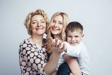 happy smiling blond family together posing cheerful on white background, generation concept....