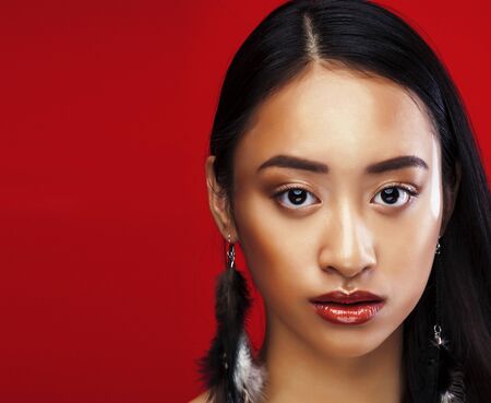 beauty young asian girl with fashion make up on red background , beauty stylish lookの写真素材
