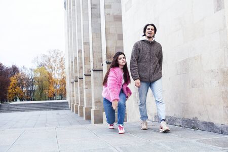young happy students teenagers at university building on stairs, lifestyle people concept boy and...