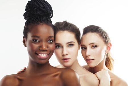different nation woman: african-american, caucasian, asian together isolated on white background happy smiling, diverse type on skin, lifestyle people conceptの写真素材