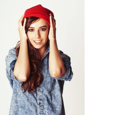 young cheerful brunette teenage girl on white backgroundの写真素材