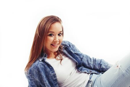 young pretty teenage hipster girl posing emotional happy smiling on white background, lifestyle people conceptの写真素材