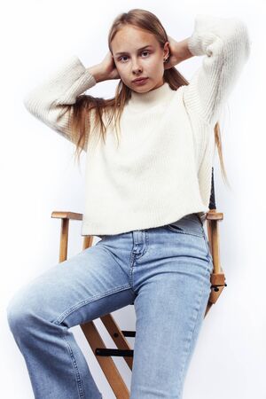 young pretty teenage hipster girl posing emotional happy smiling on white background, lifestyle people conceptの写真素材