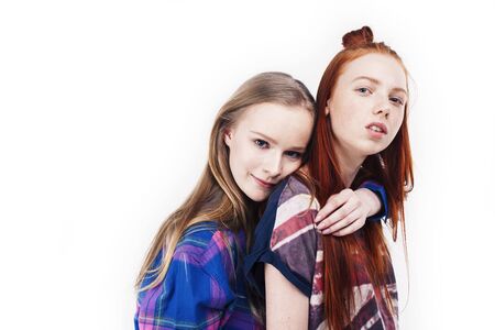 best friends teenage girls together having fun, posing emotional on white background, besties happy smiling, lifestyle people conceptの写真素材