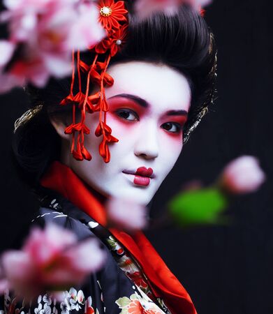 young pretty geisha in kimonoの写真素材