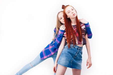 best friends teenage girls together having fun, posing emotional on white background, besties happy smiling, lifestyle people conceptの写真素材