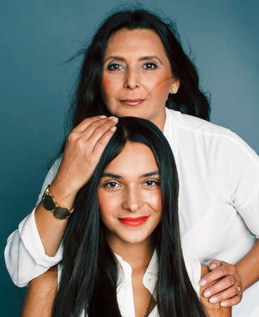 cute pretty teen daughter with mature mother hugging, fashion style brunette, lifestyle people...