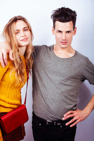 young attractive couple together having fun happy smiling isolated on white background, emotional posing, lifestyle people conceptの写真素材