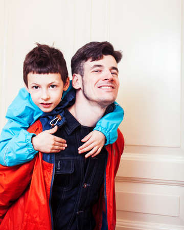 faher and son together having fun at home, lifestyle happy family, people at homeの写真素材