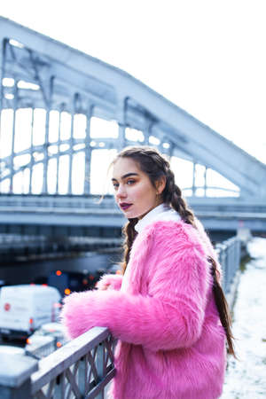 young pretty teenage girl posing cheerful happy smiling wearing street style outside in europe city, lifestyle people conceptの写真素材