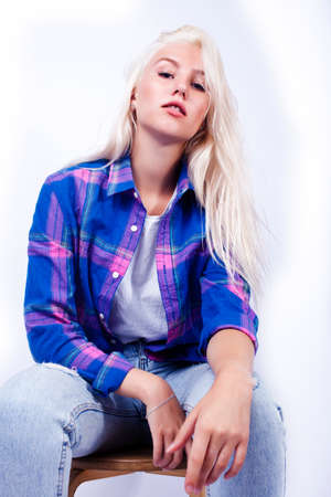 young pretty blond teenage hipster girl posing emotional happy smiling, gesturing isolated on white background, lifestyle poeple conceptの写真素材