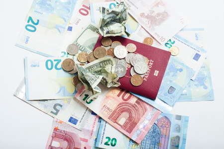 Cash on table isolated: dollars, euro, rubl broken money. All in mess, global crisis . passport travel conceptの写真素材