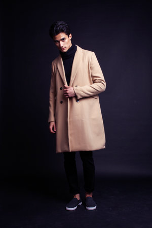 handsome asian fashion looking man posing in studio on black background, lifestyle modern people conceptの写真素材