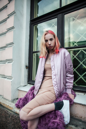 teenage girl infront of university building smiling, having fun, lifestyle real people conceptの写真素材