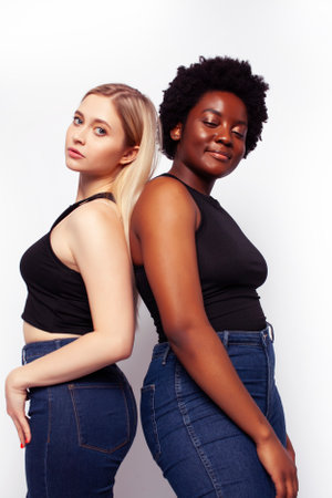 teenage friends cheerful having fun, happy smiling, cute posing isolated on white background, lifestyle people concept, african-american and caucasianの写真素材