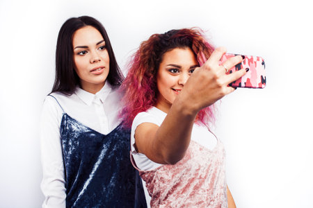 best friends diverse races teenage girls together having fun, asian and african , posing emotional...